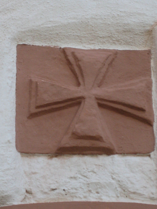 Wallfahrer an einer Wand